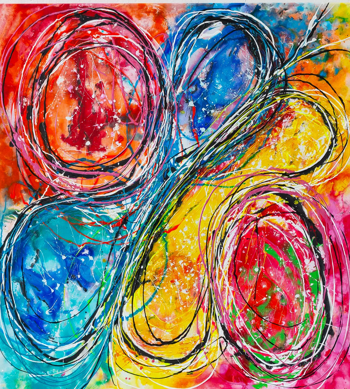 Four interlocking circular forms in red, blue, yellow and pink, outlined with black contour lines