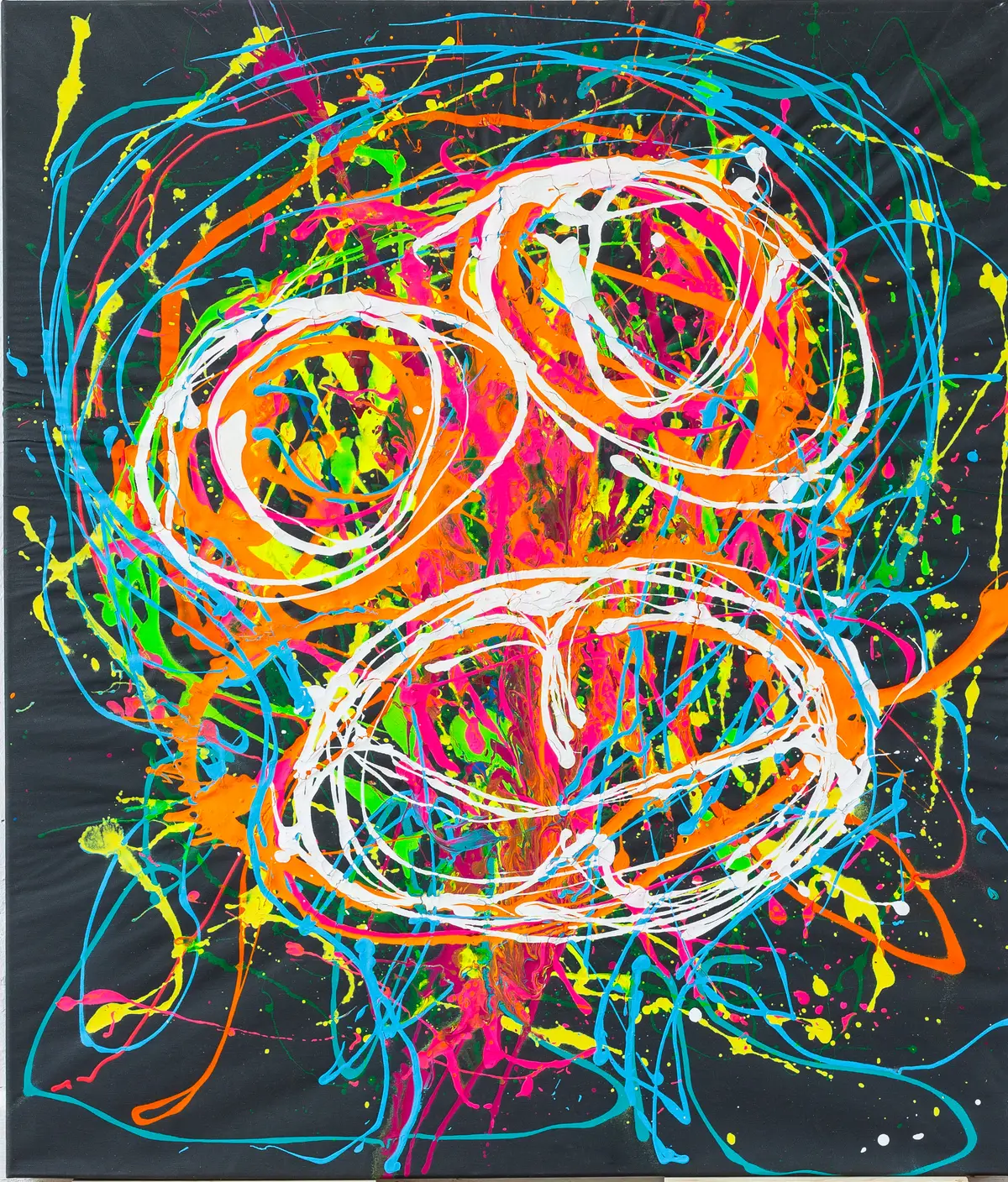 Two large white looping circles above turquoise, orange and pink flung lines on a black ground